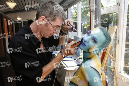 Jörg Düsterwald mit Model Sarah