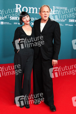 Katharina John, Ulrich Tukur