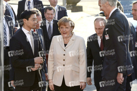 Philipp Rösler, Angela Merkel, Wladimir Putin