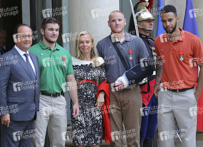 French President Francois Hollande Receives Train Attack Heroes At Elysee Palace
