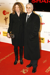 Henry Hübchen mit Partnerin