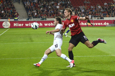 Szabolcs Huszti, Nemanja Vidic