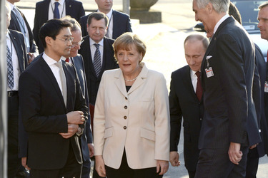 Philipp Rösler, Angela Merkel, Wladimir Putin