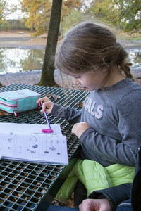 Symbolfoto Hausaufgaben im Freien